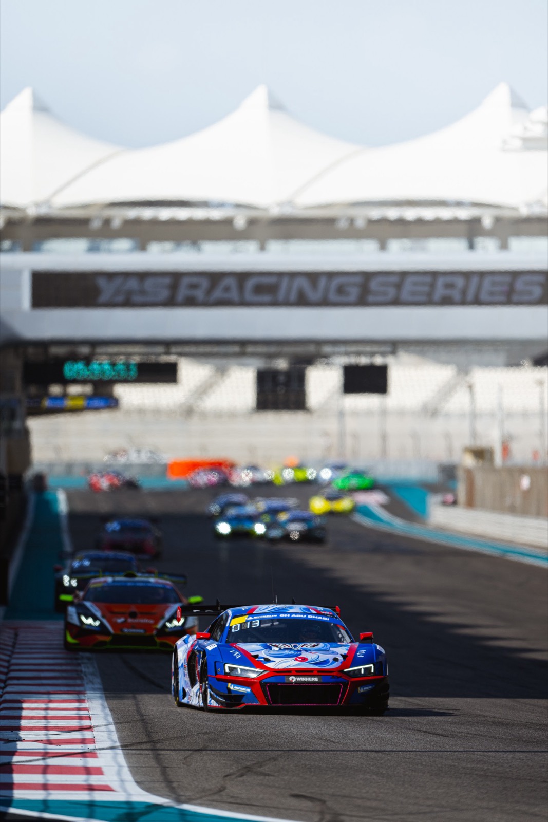 The team’s Audi R8 LMS GT3 leading a pack out of the last corner at Yas Marina, 6H Abu Dhabi.