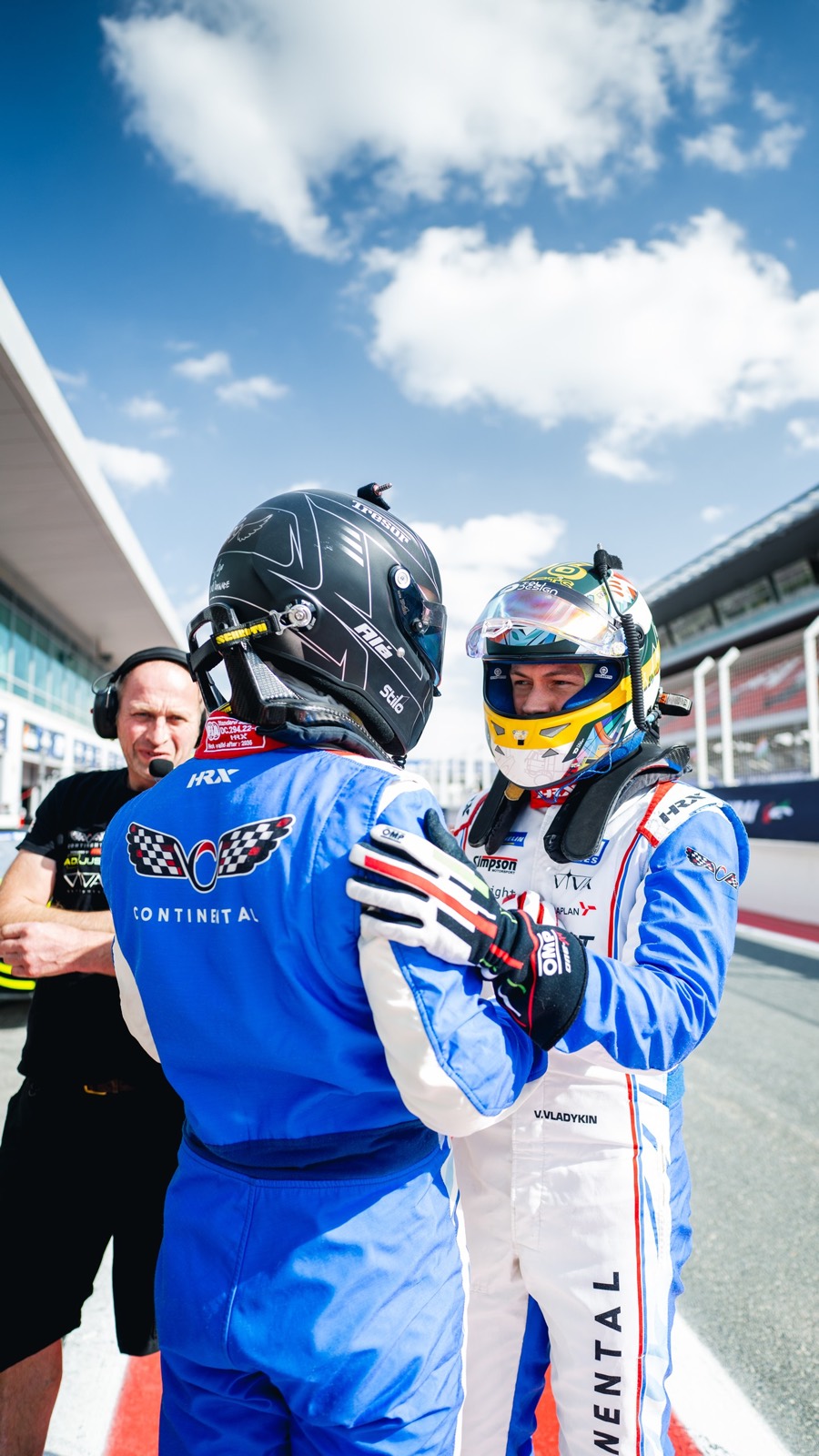 Two drivers embrace in the pit lane before the start, Dubai 24 Hour 2026