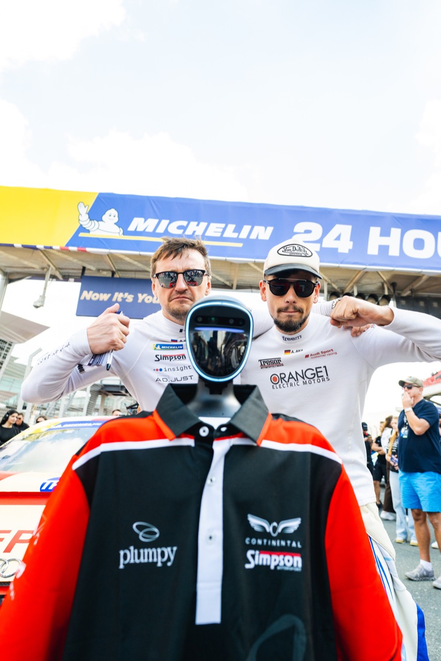 Two of the drivers behind the team shirt under the Michelin 24 Hours banner, Dubai 2026