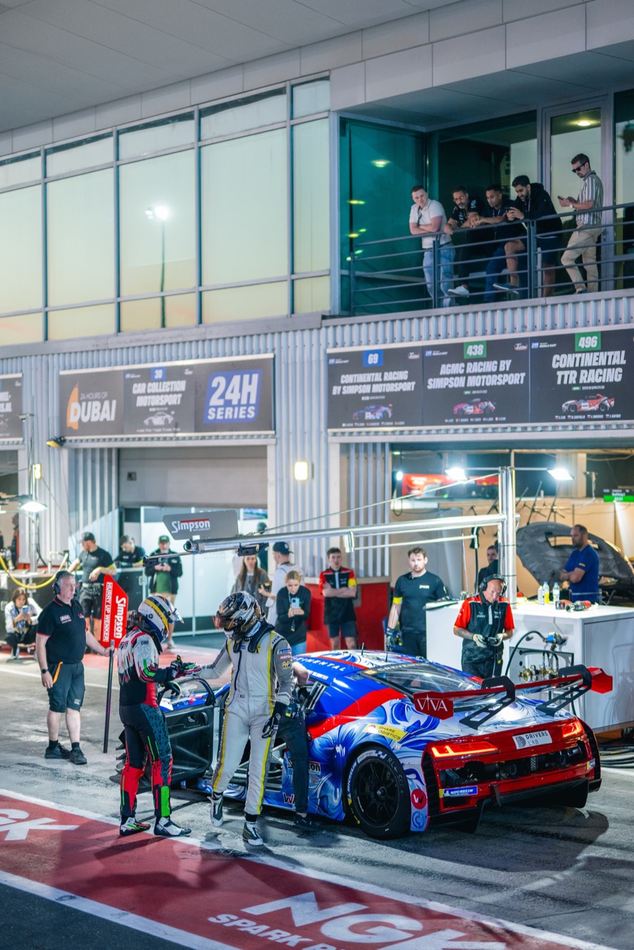 Driver change at the number 69 Audi under the pit-lane lights, 24 Hours of Dubai